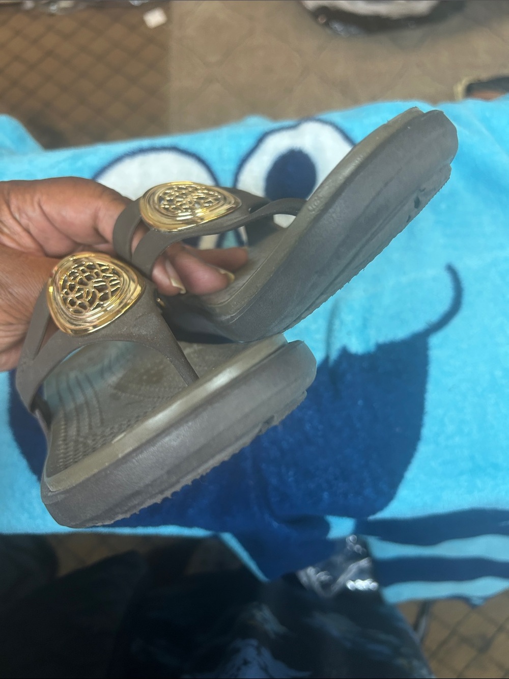 CROCS Women's Brown Thong Sandals with Gold Accent Medallion - Picture 6 of 9